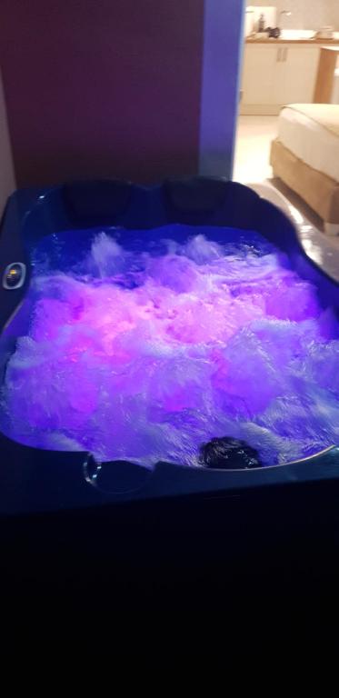 Illuminated indoor hot tub/jacuzzi.