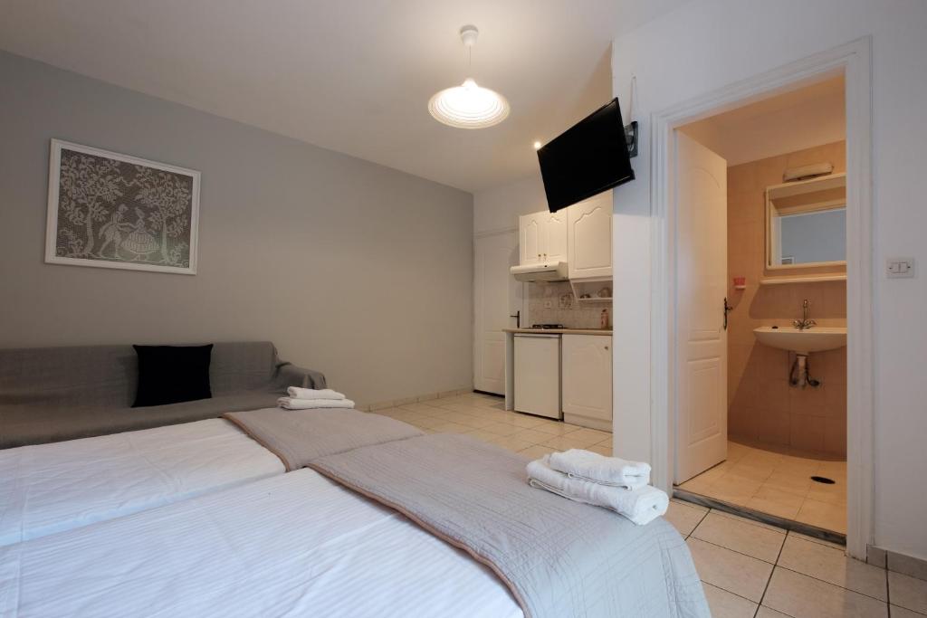 Studio interior with a double bed and kitchenette