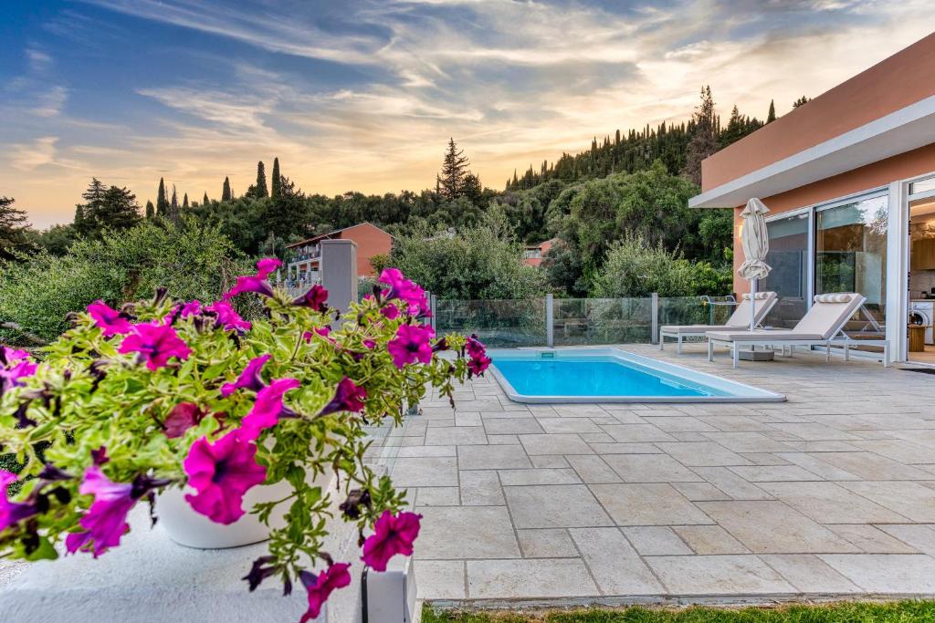 The private pool of the Villa with Private Pool, with sun loungers beside it