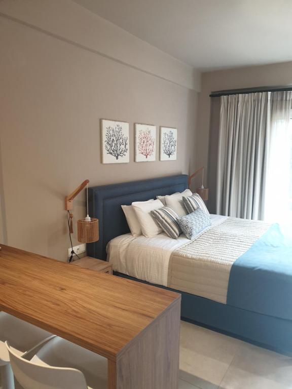 Guest-room bedroom interior with light neutral finishes.