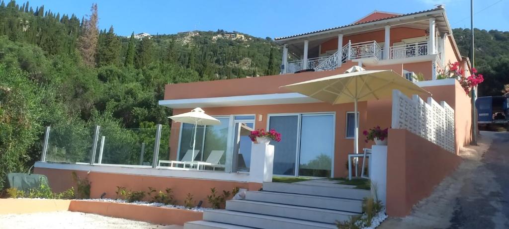 Exterior view of the lower modern unit and surrounding hillside.