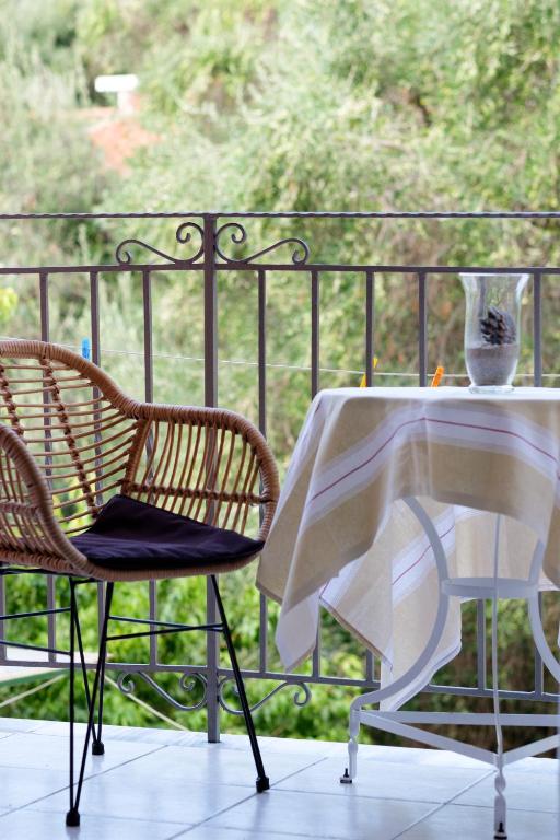 Balcony seating surrounded by greenery