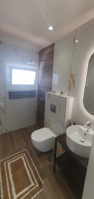 Bathroom with shower and light finishes.