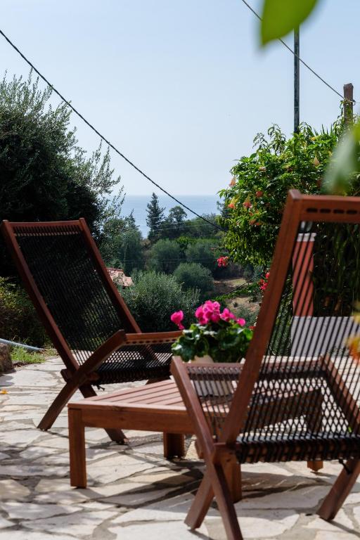 Outdoor table and chairs in a planted setting.