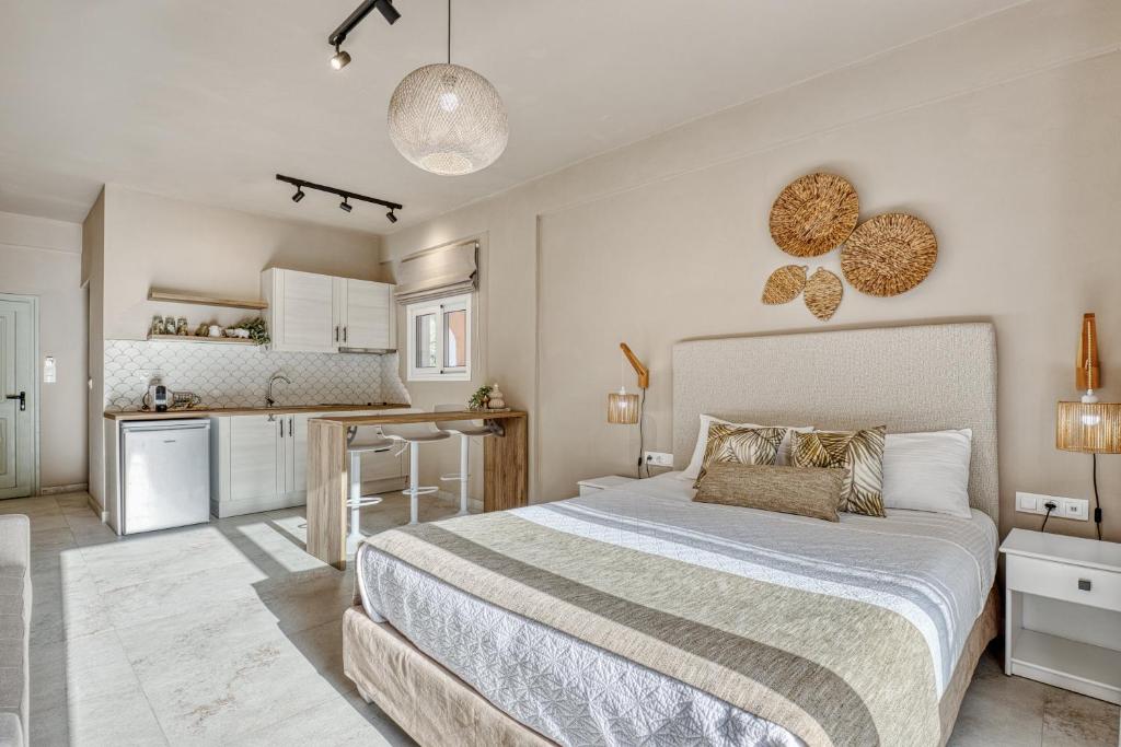 Bright renovated unit with bed and kitchenette.